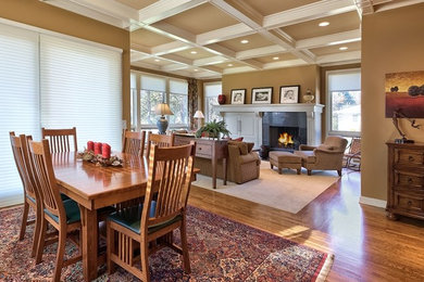 Inspiration for a large timeless open concept dark wood floor family room remodel in Omaha with beige walls, a standard fireplace, a stone fireplace and no tv