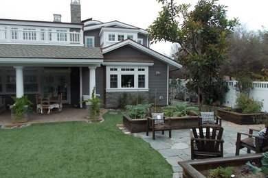 Large elegant gray two-story concrete fiberboard exterior home photo in San Diego with a shingle roof