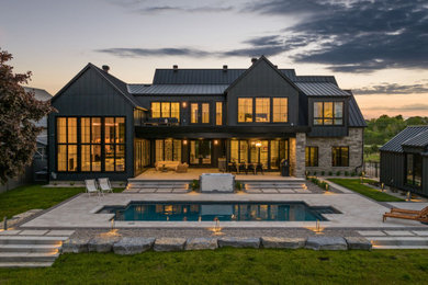 Example of a country exterior home design in Toronto