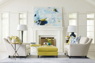 Example of a mid-sized eclectic formal and enclosed carpeted living room design in Wichita with white walls, a standard fireplace, a plaster fireplace and no tv