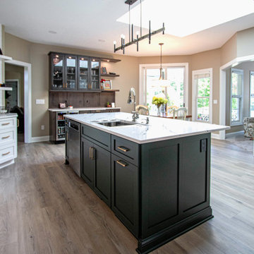 3 Finishes on Kitchen Cabinetry with Galley Workstation in Island and Wine Bar