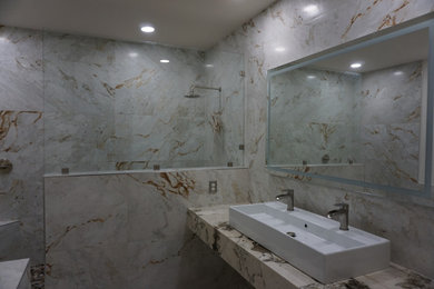 Bathroom - large modern master white tile and porcelain tile porcelain tile, white floor and single-sink bathroom idea in Las Vegas with a one-piece toilet, white walls, a vessel sink, granite countertops, white countertops and a freestanding vanity