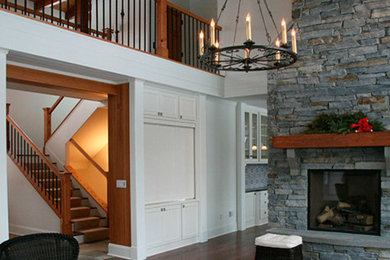 Living room - cottage formal dark wood floor living room idea in Other with white walls, a two-sided fireplace and a stone fireplace