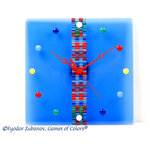 Games of Colors - Wall clock "Sweet Candies", Blue - This elegant beautiful fused glass wall clock looks like popular candies laying on a colorful transparent surface. No numbers, just blue, green, yellow and white pebbles-"candies". Red hands enhance this illusion and compliment color harmony. The surface transparency makes an illusion of lightweight "flying" body. The central part has a unique striped pattern which may differ from the shown at the pictures.