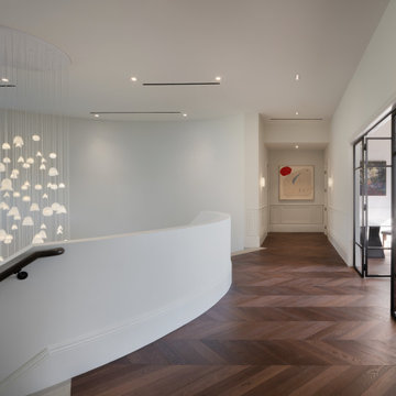 Custom Glass Installation in a Double-Height Foyer