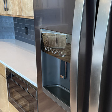 Angled Kitchen Design with Slab Style Cabinets in Pecan Stain