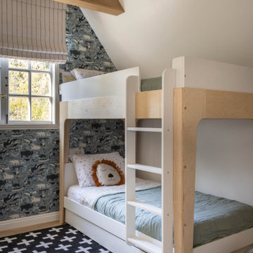 Kids’ Bedroom with Blue Printed Wallpaper, Bunk Beds, and Layered Rugs