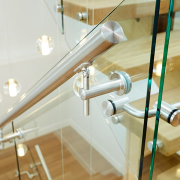 white oak mono stringer with stainless steel hand rail