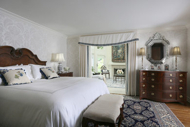 This is an example of a transitional bedroom in Cleveland.