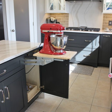Quad Cities Kitchen With Gray Base Cabinets and Waterfall Counters