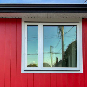JH Aspyre Collection T&G V-Groove vertical siding in Heritage Red + JH Smooth Tr