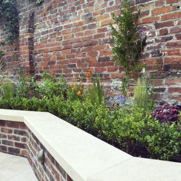 Walled town garden with views to a spectacular church