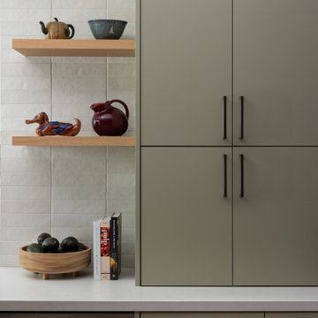 Hidden Appliance Garage in Sage Green Kitchen Cabinetry