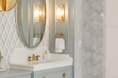 Large transitional bathroom photo in New York with recessed-panel cabinets, gray cabinets and a built-in vanity