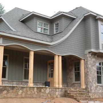 Stone, shake, arches, columns, board and batten
