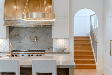 Example of a transitional kitchen design in Calgary