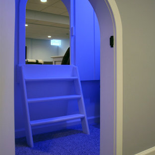 Photo of a large traditional look-out basement in Philadelphia with blue walls and vinyl flooring.