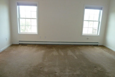 Example of a mid-sized trendy master bedroom design in New York with multicolored walls