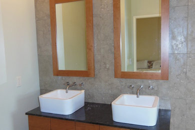 Mid-sized trendy 3/4 beige tile, brown tile and porcelain tile ceramic tile and beige floor bathroom photo in San Francisco with flat-panel cabinets, dark wood cabinets, beige walls, a vessel sink and quartz countertops
