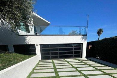 Example of a trendy rooftop rooftop glass railing deck design in Los Angeles with no cover
