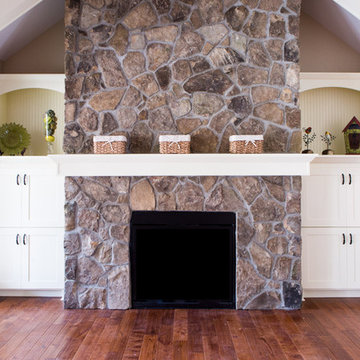 Fireplace flanked with Bookshelves