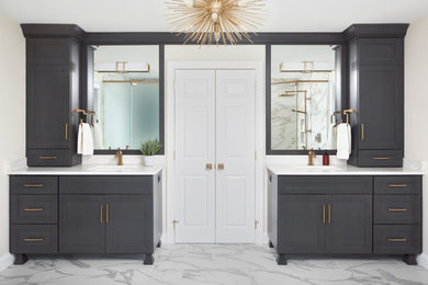Inspiration for a large transitional master white tile and porcelain tile porcelain tile, white floor and double-sink bathroom remodel in Philadelphia with flat-panel cabinets, gray cabinets, a one-piece toilet, gray walls, an undermount sink, quartz countertops, a hinged shower door, white countertops and a built-in vanity