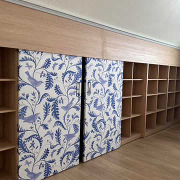 Custom Built-In Bookshelf with Blue Chinoiserie Sliding Panels