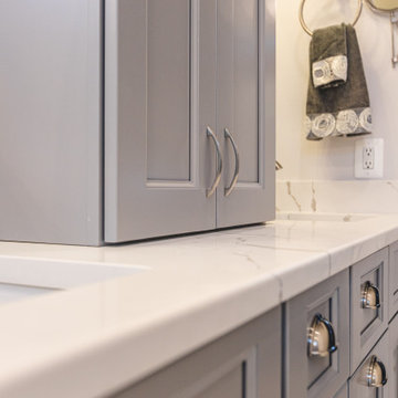 Sleek bathroom remodel in Centerville, VA with double vanity & walk-in shower