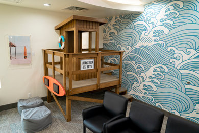 Beach style home design photo in Other