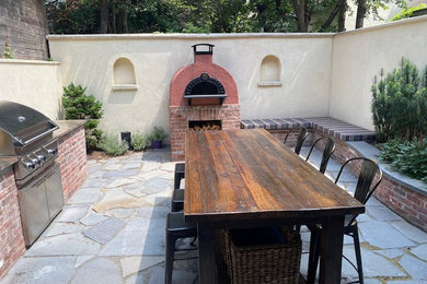 Patio - french country patio idea in New York
