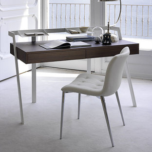 Inspiration for a medium sized modern study in Miami with white walls, concrete flooring, no fireplace, a freestanding desk and white floors.