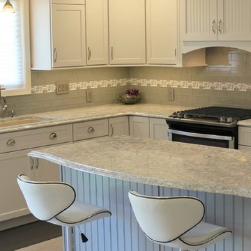 Alpha, IL White and Gray Kitchen with Hidden Laundry and Raised Dishwasher