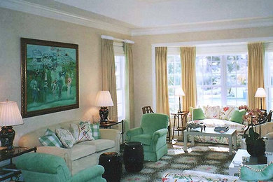 Large eclectic travertine floor living room photo in New York with beige walls and a stone fireplace