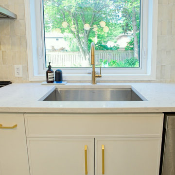 Gold Kitchen Faucet and Undermount Sink Beneath the Window | Etobicoke