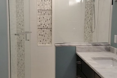 Design ideas for a transitional bathroom in Minneapolis with dark wood cabinets, white tile, glass tile and blue walls.