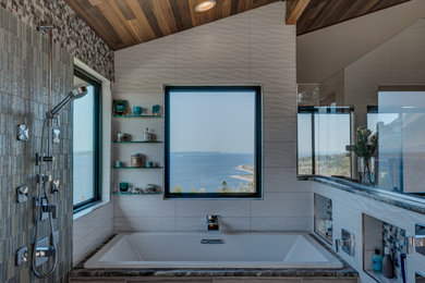 Mid-sized transitional master gray tile and porcelain tile porcelain tile, gray floor, double-sink and wood ceiling bathroom photo in Seattle with raised-panel cabinets, brown cabinets, a bidet, gray walls, an undermount sink, quartz countertops, white countertops and a built-in vanity