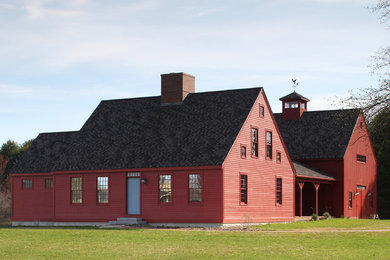 Inspiration for a country red two-story exterior home remodel in Portland Maine