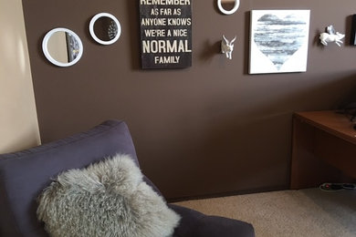 Small farmhouse guest carpeted and beige floor bedroom photo in Edmonton with brown walls