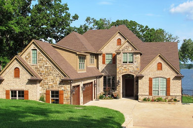 Example of a large classic brown two-story mixed siding exterior home design in Austin