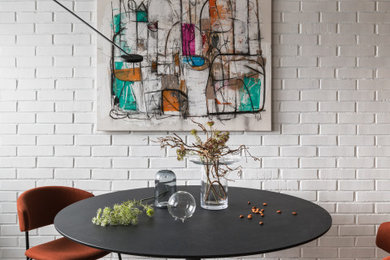 Example of a mid-sized urban porcelain tile and gray floor kitchen/dining room combo design in Other