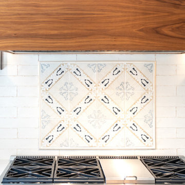 Kitchen Range Accent with Patterned Tile Inlay and Walnut Hood