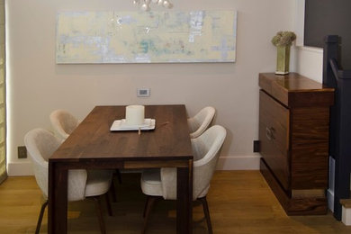 Example of a mid-sized mid-century modern light wood floor kitchen/dining room combo design in San Francisco with white walls