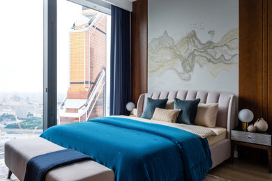 Источник вдохновения для домашнего уюта: хозяйская спальня среднего размера в современном стиле с серыми стенами, светлым паркетным полом и бежевым полом