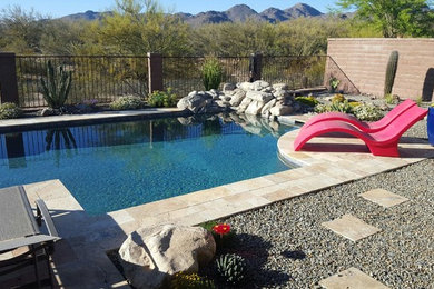 Inspiration for a large modern backyard stone and rectangular natural pool fountain remodel in Phoenix