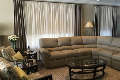 Example of a mid-sized transitional open concept medium tone wood floor family room design in Vancouver with gray walls and a wall-mounted tv