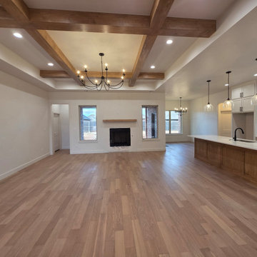 Open concept living area with gas fireplace and seated kitchen island