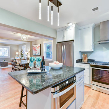 Open kitchen, family style, eat in island Stainless steel appliances