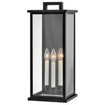 HInkley - Hinkley Weymouth Large Wall Mount Lantern, Black - Modernize your outdoor space without sacrificing the traditional appeal you long for. Weymouth's subtle yet overstated frame features a clean design, while its symmetrical lines evoke timeless elegance with a contemporary edge. The contrast candle sleeves in warm white balance the robust aluminum cast frame. The beveled glass is an elegant touch to help refract the light.