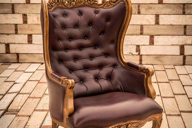 Extraordinary Antique Arm Chair in wine leather. Dimensions: 32" D x 31" W x 49"