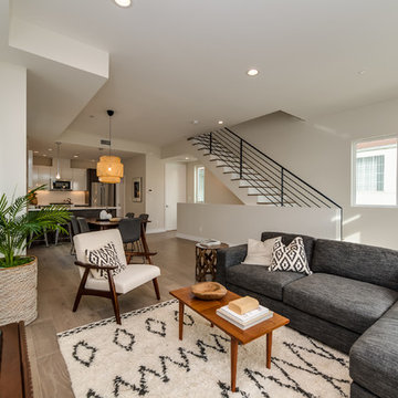 Earthy Neutral B&W Space with Moroccan Rug and Mid Century Chairs